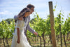 Couple walking within the Chapel Down Vines during Vine to Wine