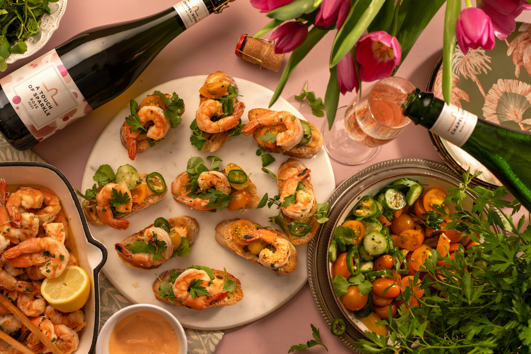 GRILLED GARLIC PRAWN CROSTINIS WITH TOMATO SALSA AND A GLASS OF ROSÉ